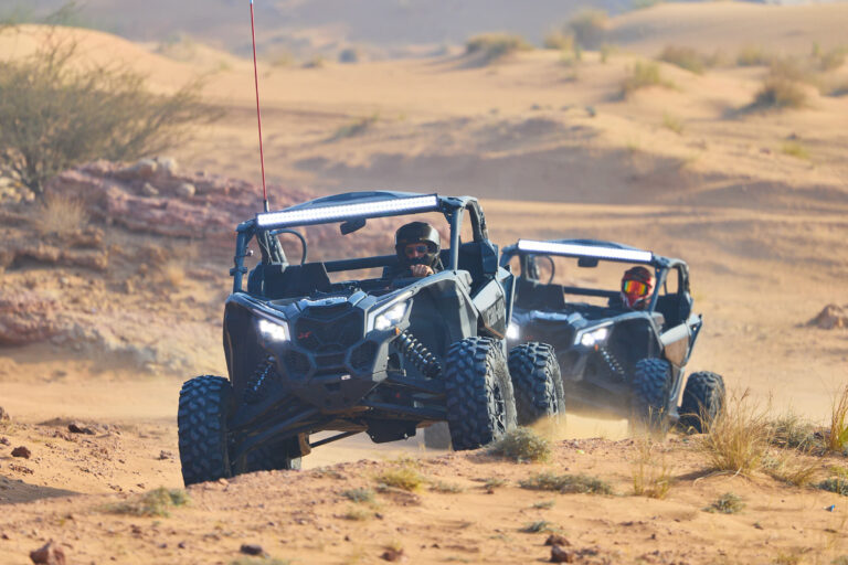 Can-Am X3 buggies convoy riding through Dubai desert