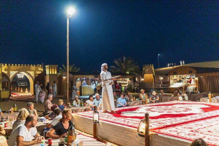 Live show performer at a Bedouin desert dinner camp near Dubai at night